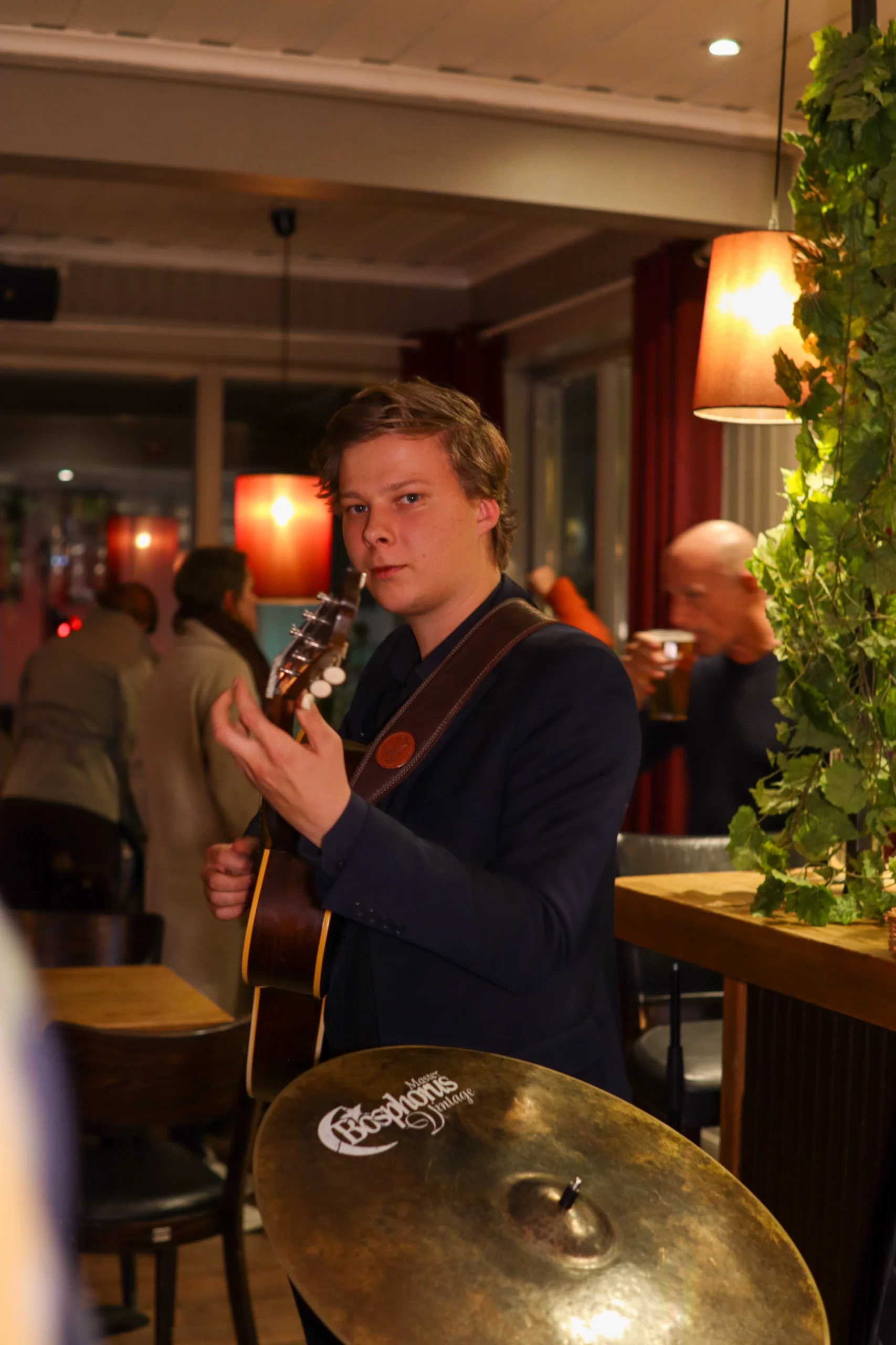 A man playing the guitar at a corporate event.